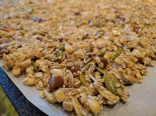Spread granola mixture out on a baking sheet covered with parchment
