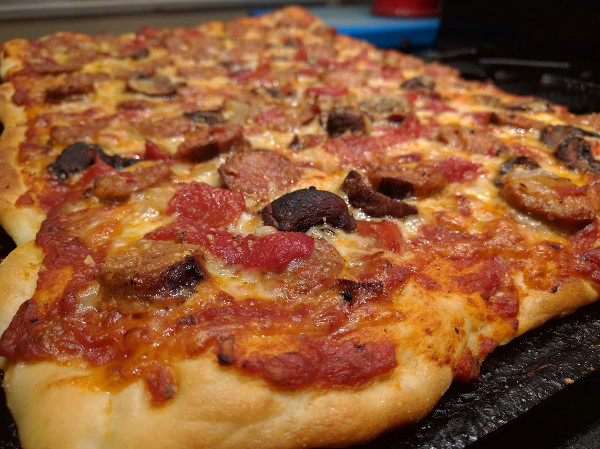 Tomato sauce pizza with chorizo sausage, mushrooms and roasted red peppers
