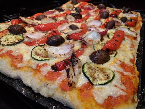 Pizza with grilled peppers, onions, mushrooms and zucchini
